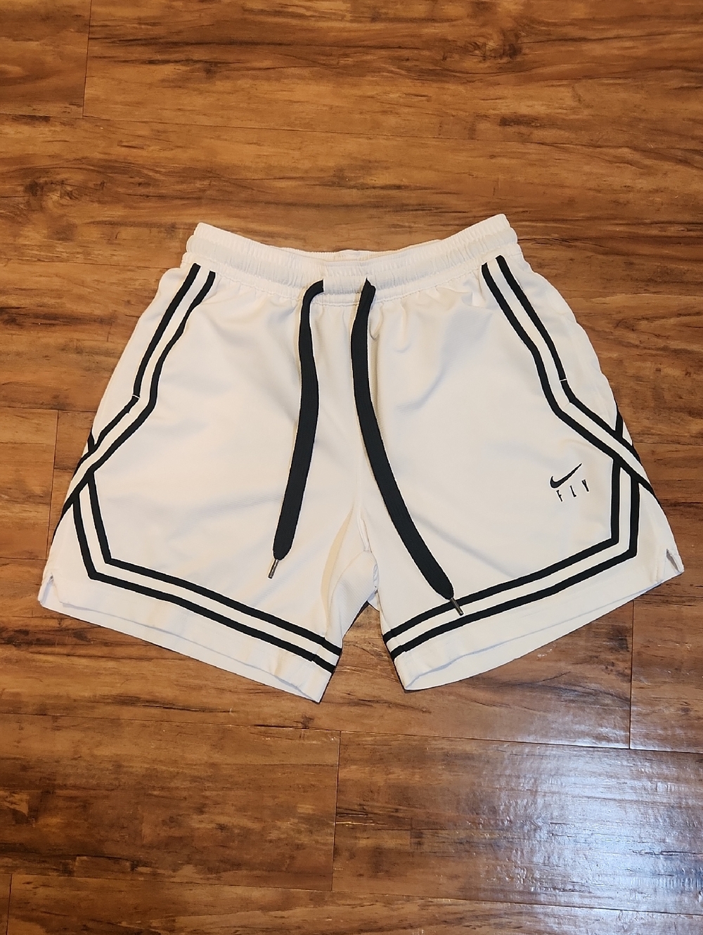 Nike White Athletic Shorts with Black Trim and Drawcord